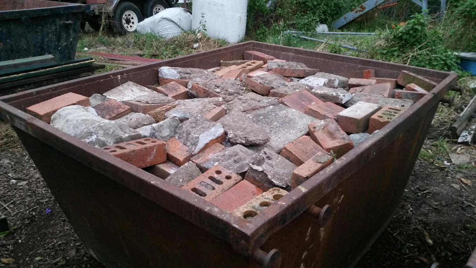 Heavy waste neatly stacked in one of Sydney's Skip Bins