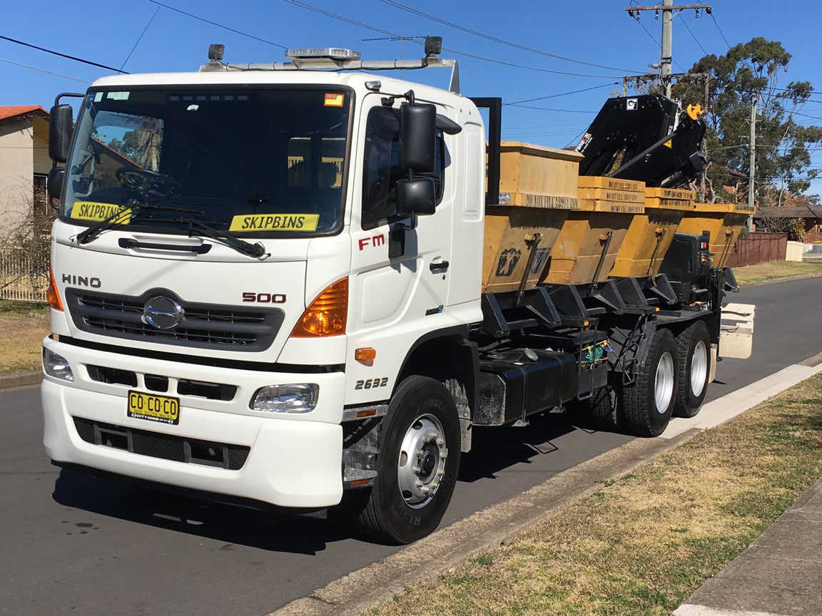Skip Bins that can be loaded and unloaded to side of truck