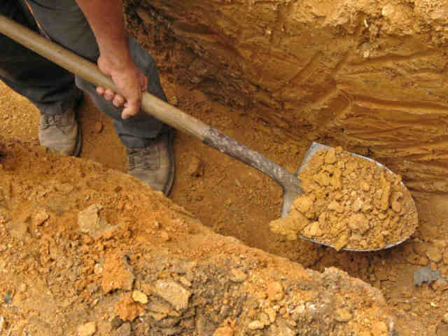 Digging soil for a Clean-fill Skip Bin