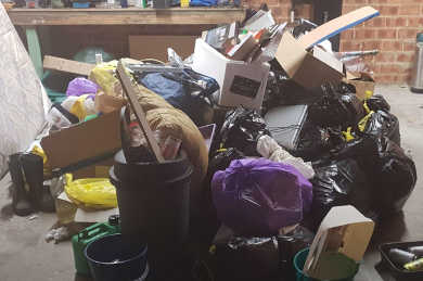 Waste from moving house ready for loading a skip bin