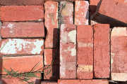 Bricks ready for a recycling skip bin