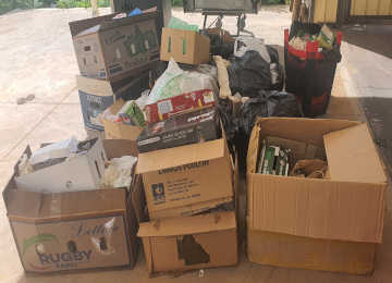 Typical light general waste loaded into cardboard boxes ready for a bin
