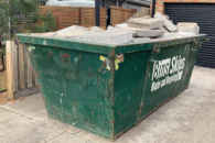 Concrete slabs in a skip bin